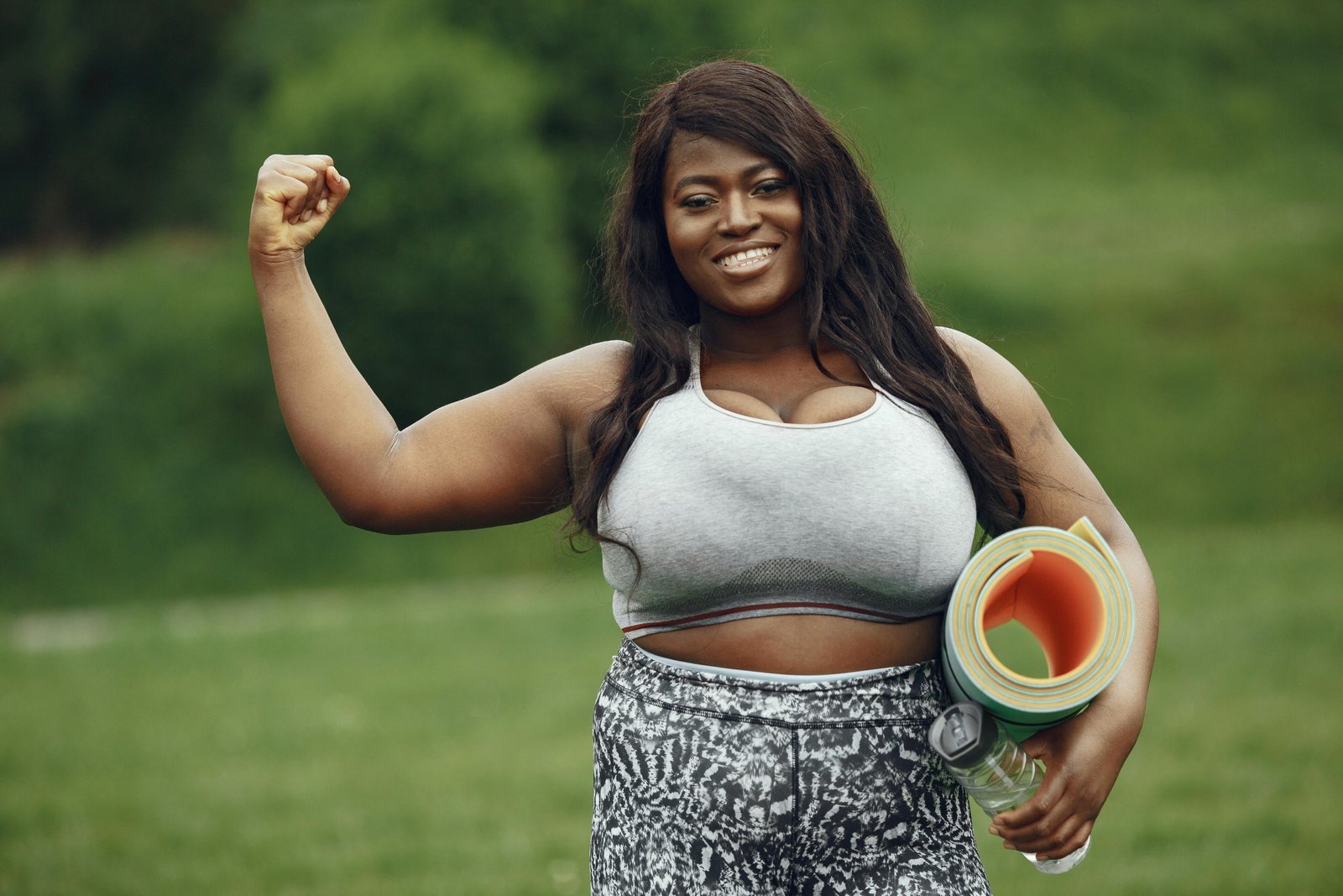 A Lady Showing off Her Muscle From Exercise-Can Obesity be Reversed