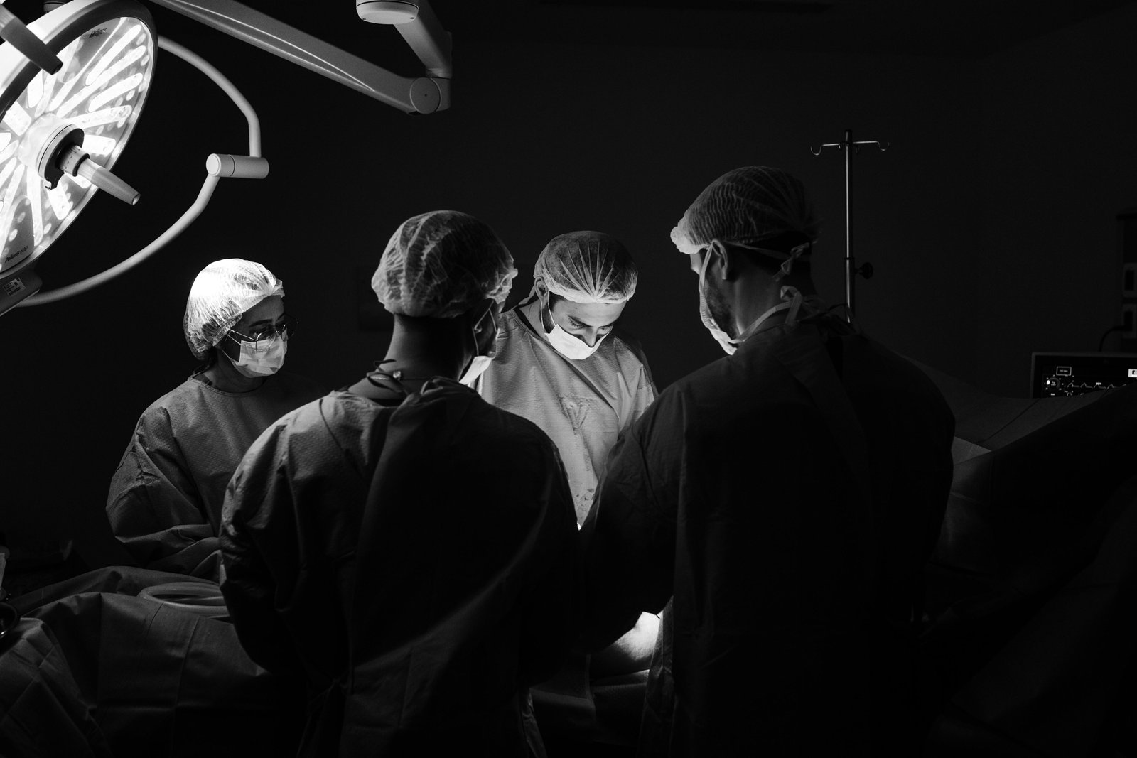 Doctors in an Operating Room Carrying out an Operation-13697925.jpg