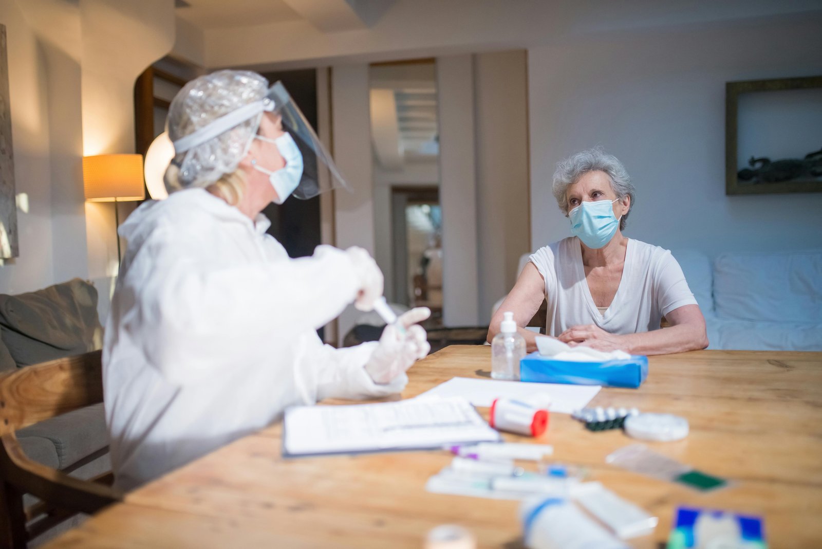 Picture of a Doctor in Quarantine Uniform and His Patient-8949900.jpg