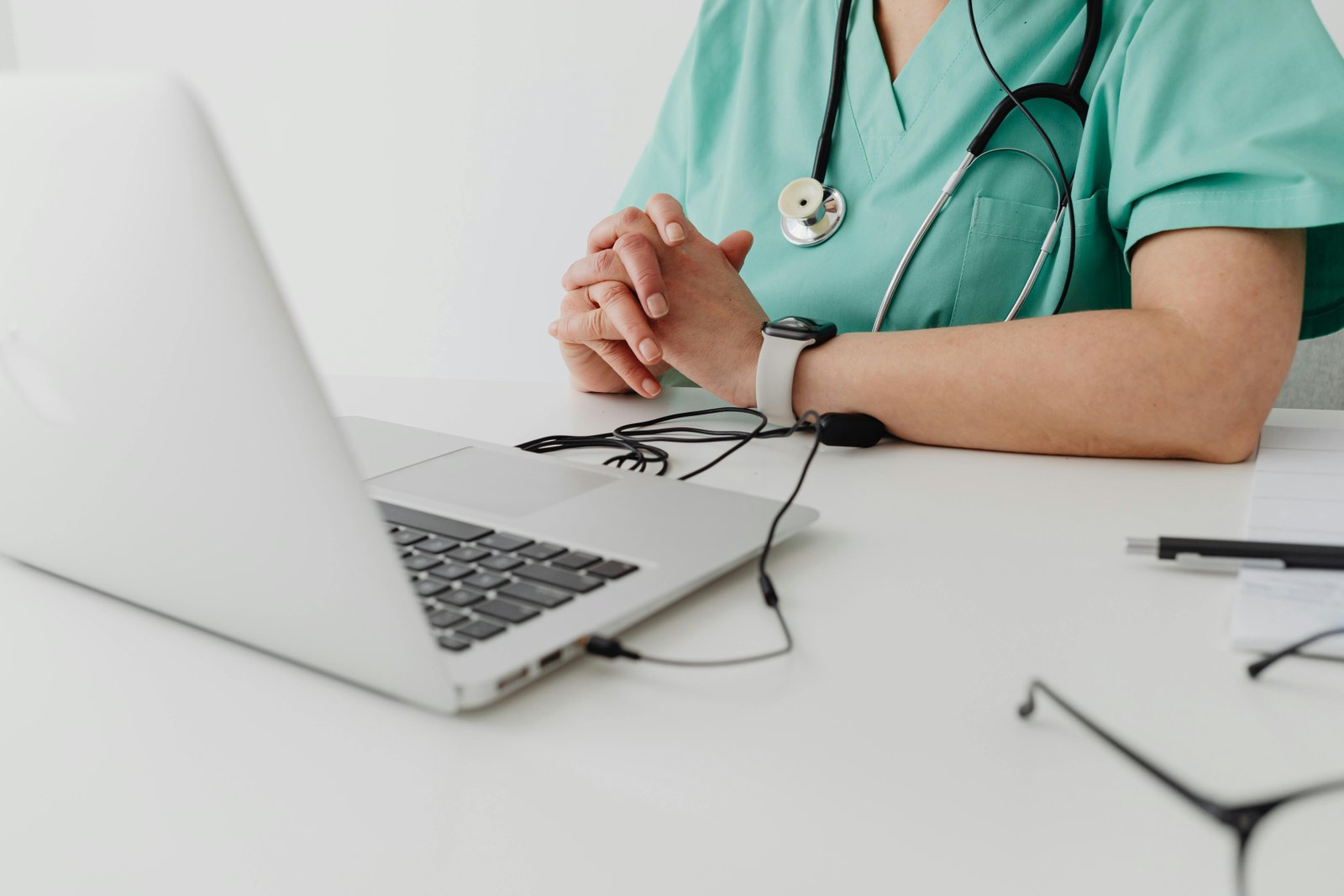 Picture Shows a Medical Attendant Sitting in Front of her Computer with a Stethoscope around Her neck-Most Common Medical Conditions-7195374.jpg