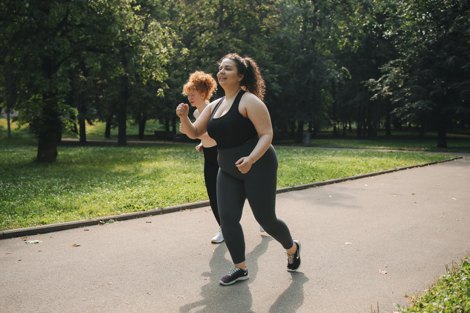Two Ladies Jogging Round a Park-Obesity Management Programs