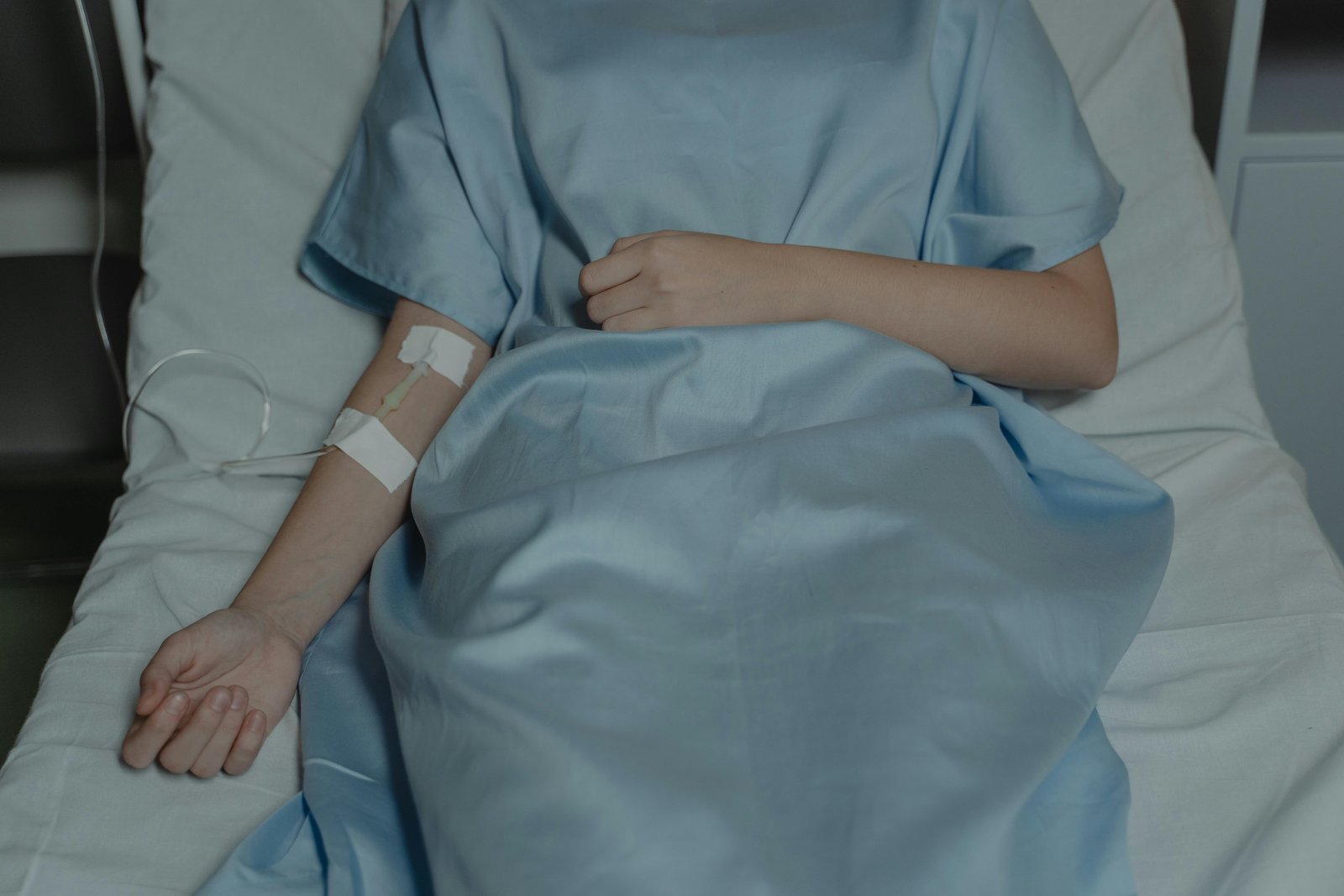 An Admitted Patient Receiving Drip on a Hospital Bed-Cancer Treatment Side Effects