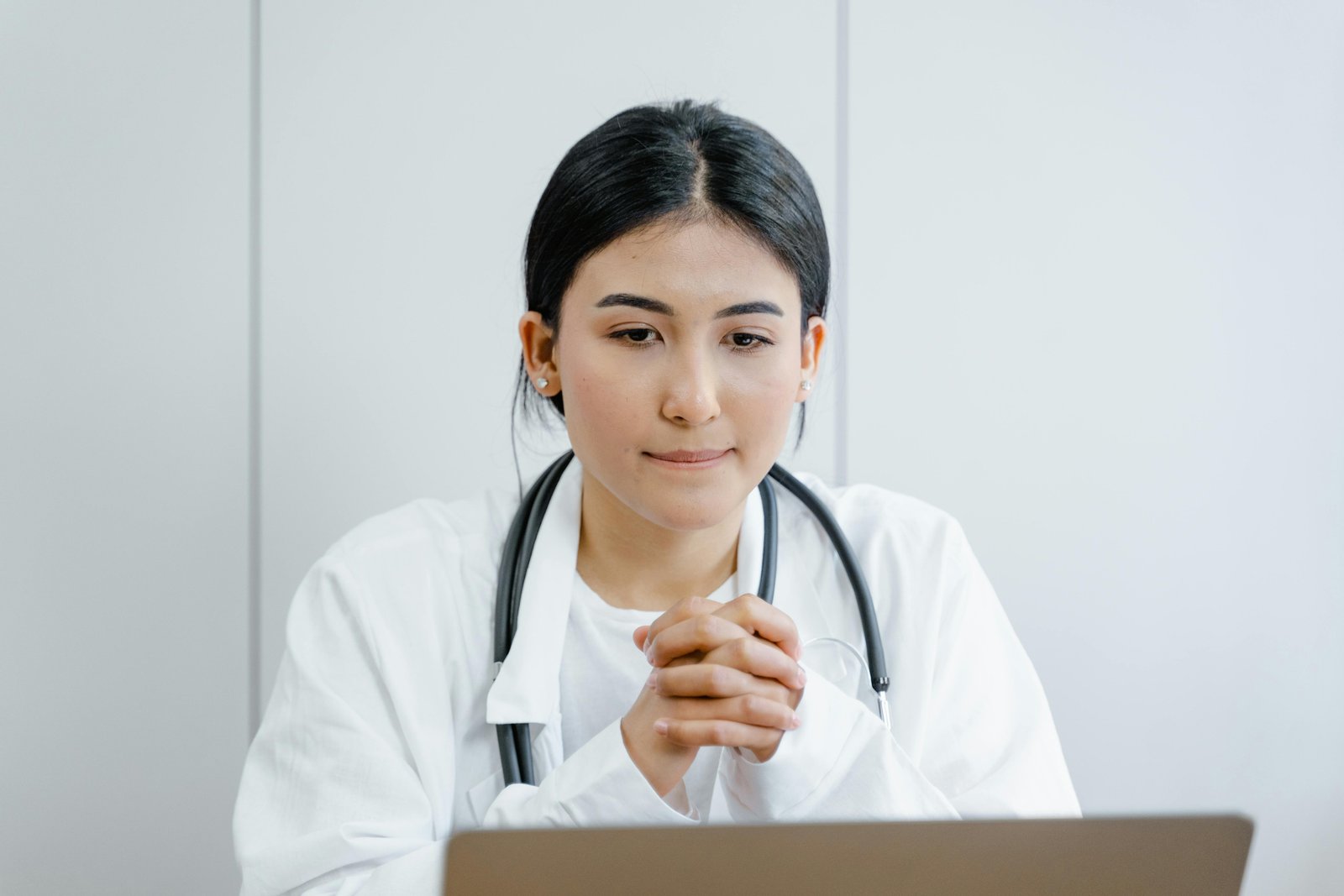 A Doctor Looking into Her Computer-Obesity Management in Primary Care