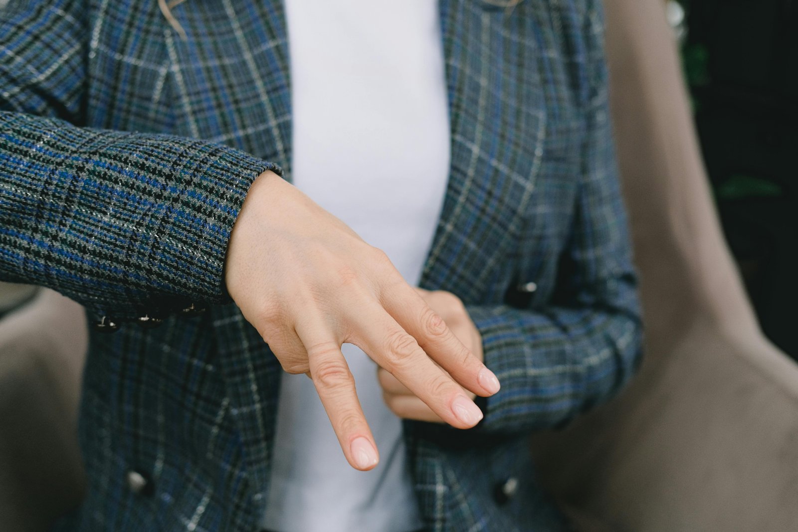 A Person Showing His Three Fingers